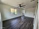 Modern living area featuring hardwood floors, a ceiling fan, and bright natural light at 1401 S Rita Ln, Tempe, AZ 85281
