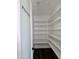 Walk-in pantry with white shelving and a door labeled 'Pantry' at 1401 S Rita Ln, Tempe, AZ 85281