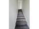 Stylish staircase with wood steps and white risers at 1401 S Rita Ln, Tempe, AZ 85281