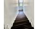 Modern staircase with wood steps and white trim at 1401 S Rita Ln, Tempe, AZ 85281