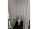 Small water closet features a toilet with black hardware and white walls at 1401 S Rita Ln, Tempe, AZ 85281