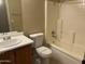 Bathroom featuring a shower-tub combo, vanity, and tile flooring at 14228 N 150Th Ln, Surprise, AZ 85379