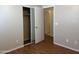 Bedroom with closet, neutral paint, and vinyl wood-look flooring at 14228 N 150Th Ln, Surprise, AZ 85379