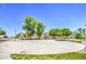 Community basketball court surrounded by lush green trees at 1624 N 77Th Gln, Phoenix, AZ 85035