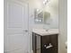 Bathroom featuring a vanity, light fixtures, and towel rack at 1624 N 77Th Gln, Phoenix, AZ 85035