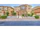 Charming two-story home with a stone facade, well-maintained landscaping, and a cozy entrance at 1624 N 77Th Gln, Phoenix, AZ 85035