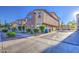 Street view of the lovely two-story home with stucco exterior, stone accents, and attached garage at 1624 N 77Th Gln, Phoenix, AZ 85035