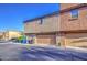 Exterior of the townhome building showing a two-car garage at 1624 N 77Th Gln, Phoenix, AZ 85035