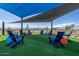 Outdoor seating area with shade for residents to gather and relax at 17805 W Vermont Ave, Litchfield Park, AZ 85340