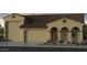 Charming home with a tile roof, arched entry and 3-car garage at 17805 W Vermont Ave, Litchfield Park, AZ 85340