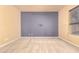 Spacious bedroom with neutral carpet, accent wall, and ample natural light at 18322 W Sweet Acacia Dr, Goodyear, AZ 85338