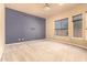 Bedroom with neutral carpet, ample natural light, and accent wall at 18322 W Sweet Acacia Dr, Goodyear, AZ 85338