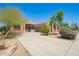 Charming single-story home with neutral-toned stucco exterior and desert landscaping at 18322 W Sweet Acacia Dr, Goodyear, AZ 85338