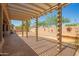 Inviting covered patio with desert landscaping and room to entertain at 18322 W Sweet Acacia Dr, Goodyear, AZ 85338