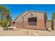 Side view of single-story home with desert landscaping and neutral-toned stucco exterior at 18322 W Sweet Acacia Dr, Goodyear, AZ 85338