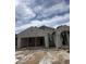 New construction home showing stucco application, framing, and tile roof installation at 1959 E Bucking Bronco Dr, San Tan Valley, AZ 85140
