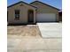 Charming single-story home featuring a two-car garage and a simple, Southwestern-style exterior at 1973 E Bucking Bronco Dr, San Tan Valley, AZ 85140