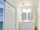 This bathroom features a double sink vanity, soaking tub, and a view to bedroom at 20411 W Mountain Sage W Dr, Buckeye, AZ 85326
