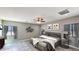Comfortable bedroom featuring neutral paint, a ceiling fan, and tile floors at 20411 W Mountain Sage W Dr, Buckeye, AZ 85326
