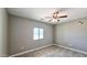 Bedroom featuring a ceiling fan, neutral paint and tile flooring at 20411 W Mountain Sage W Dr, Buckeye, AZ 85326
