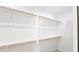 Walk-in closet with shelving units and wood racks at 20411 W Mountain Sage W Dr, Buckeye, AZ 85326