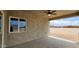 View from covered patio shows large property and exterior wall with a window at 20411 W Mountain Sage W Dr, Buckeye, AZ 85326