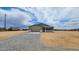 Charming single-story home featuring a two-car garage and gravel landscaping at 20411 W Mountain Sage W Dr, Buckeye, AZ 85326