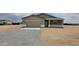 Single story home featuring gravel landscaping, two-car garage and traditional architecture at 20411 W Mountain Sage W Dr, Buckeye, AZ 85326