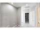 Bright hallway with tile flooring, neutral paint and new outlets at 20411 W Mountain Sage W Dr, Buckeye, AZ 85326