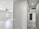 View of new hallway leading to bedroom and bathroom with recessed lights at 20411 W Mountain Sage W Dr, Buckeye, AZ 85326