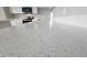 Close-up of a kitchen countertop with modern appliances including a microwave and oven in the background at 20411 W Mountain Sage W Dr, Buckeye, AZ 85326