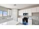 Modern kitchen features white cabinets and quartz countertops at 20411 W Mountain Sage W Dr, Buckeye, AZ 85326