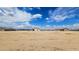 Wide aerial view of the home showcasing its location within a desert landscape at 20419 W Mountain Sage Dr, Buckeye, AZ 85326