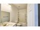 Clean bathroom featuring a shower-tub combo, single sink vanity, and modern fixtures at 20419 W Mountain Sage Dr, Buckeye, AZ 85326
