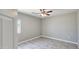 Bedroom with a ceiling fan, tile floors, and a window to let in natural light at 20419 W Mountain Sage Dr, Buckeye, AZ 85326