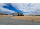 Well-maintained single-story home with a gravel driveway and neutral-colored exterior at 20419 W Mountain Sage Dr, Buckeye, AZ 85326