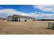 Charming single-story home with stucco exterior, and an attached garage, all under a clear blue sky at 20419 W Mountain Sage Dr, Buckeye, AZ 85326