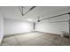 Large, clean garage space with overhead lighting and ample room for storage and vehicles at 20419 W Mountain Sage Dr, Buckeye, AZ 85326