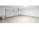 Spacious two-car garage featuring an automatic door opener and concrete floor at 20419 W Mountain Sage Dr, Buckeye, AZ 85326