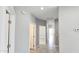 Hallway featuring neutral walls and floors with views into other rooms at 20419 W Mountain Sage Dr, Buckeye, AZ 85326