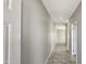 Bright hallway featuring tile flooring and neutral paint, ready for your personal touch at 20419 W Mountain Sage Dr, Buckeye, AZ 85326