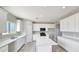 The Kitchen boasts white cabinets and countertops, stainless steel appliances and large island at 20419 W Mountain Sage Dr, Buckeye, AZ 85326