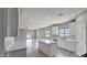 Spacious kitchen with white cabinetry, center island, and views of the outside at 20419 W Mountain Sage Dr, Buckeye, AZ 85326