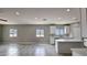 Bright, open-concept kitchen featuring an island, ample counter space, and white cabinets at 20419 W Mountain Sage Dr, Buckeye, AZ 85326