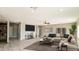 Open living room featuring tile floors, recessed lighting, ceiling fan, and neutral-toned walls at 20419 W Mountain Sage Dr, Buckeye, AZ 85326