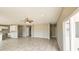 Open concept living space with kitchen and access to outdoor patio at 20419 W Mountain Sage Dr, Buckeye, AZ 85326
