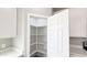 Walk-in pantry with shelving, adjacent to the kitchen at 20419 W Mountain Sage Dr, Buckeye, AZ 85326