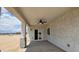 Covered patio features ceiling fan, and neutral color palette at 20419 W Mountain Sage Dr, Buckeye, AZ 85326