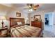 Cozy bedroom featuring wood furnishings and a comfortable, patterned quilt on the bed at 2101 S Meridian Rd # 250, Apache Junction, AZ 85120