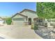 Beautiful single-Gathering home with desert landscaping and a cozy front porch seating area at 2101 S Meridian Rd # 250, Apache Junction, AZ 85120
